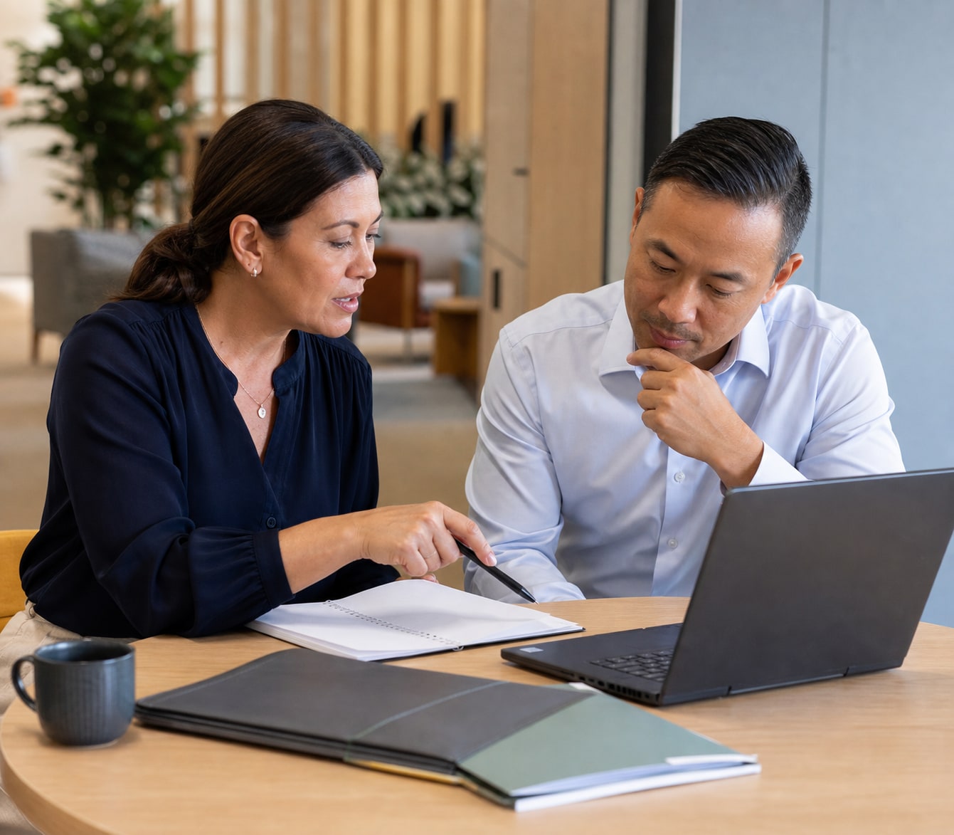 Career adviser helping a professional turn duties into achievement evidence.